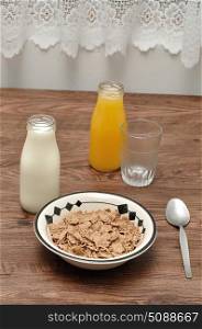 Breakfast with cereal, milk, orange juice