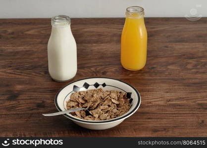 Breakfast with cereal, milk, orange juice