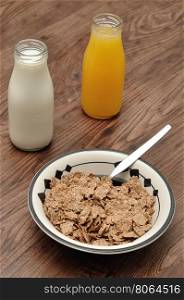 Breakfast with cereal, milk, orange juice