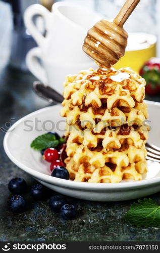Breakfast with coffee and waffles