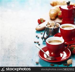 Breakfast with coffee, croissants and berries. Blue background