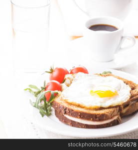 Breakfast with coffee, Croque Madame sandwich close up