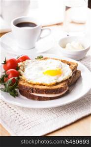 Breakfast with coffee, Croque Madame sandwich close up