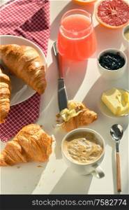 Breakfast With Coffee, Juice And Croissant on White Table