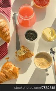 Breakfast With Coffee, Juice And Croissant on White Table