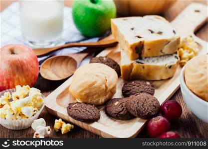breakfast with cookie, bread , fresh fruits for healthy eating and milk, mix food