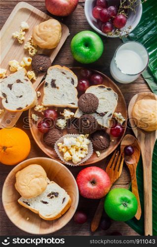 breakfast with cookie, bread , fresh fruits for healthy eating and milk, mix food
