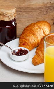 Breakfast with croissant and juice