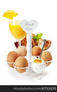 Breakfast with eggs croissants and orange juice