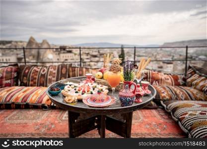 Breakfast with great landscape on rooftop of cave house in Goreme city, Cappadocia Turkey.