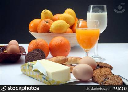 Breakfast with juice, milk, fruits and eggs
