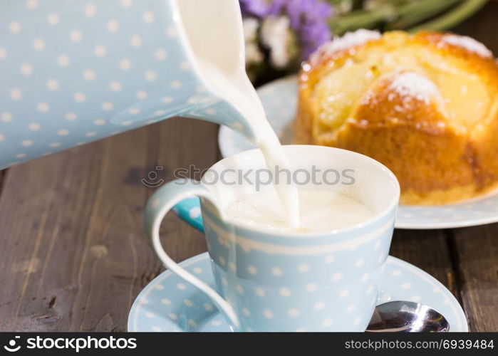 Breakfast with milk and a homemade sponge cake