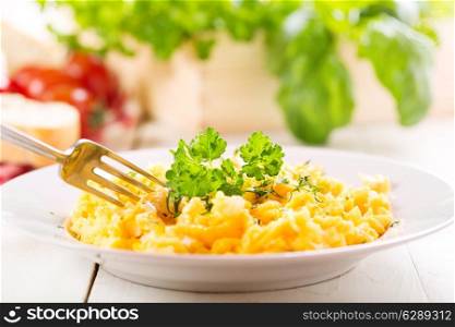 breakfast with plate of scrambled eggs