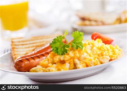 breakfast with scrambled eggs and sausages