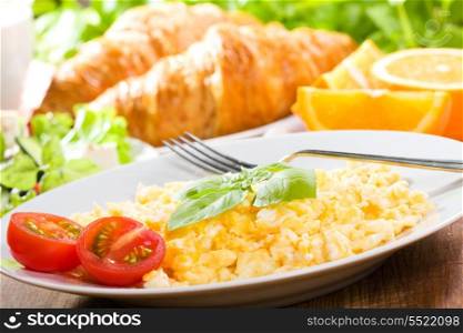 breakfast with scrambled eggs and vegetables