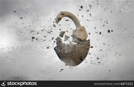 Breaking. Conceptual image with stone broken lock as security concept