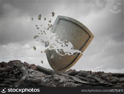 Breaking through security. Conceptual image with old stone broken shield