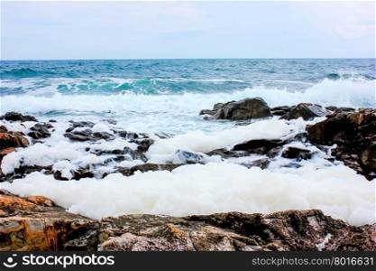breaking waves of the Black Sea in the rocks on the beach near Sozopol in windy summer day
