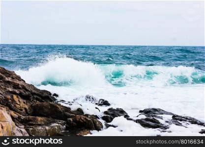 breaking waves of the Black Sea in the rocks on the beach near Sozopol in windy summer day