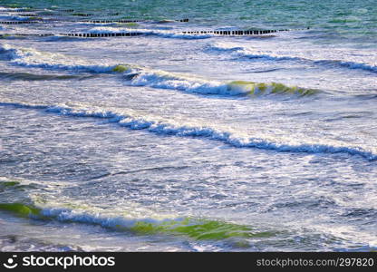 breaking waves rolling to beach