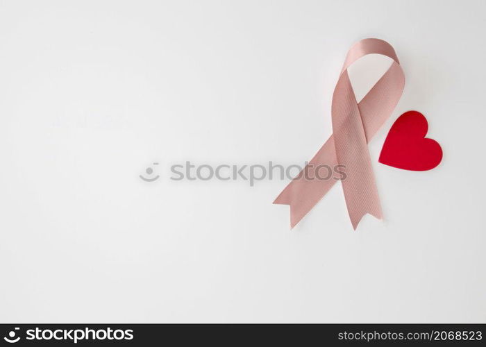 Breast Cancer Awareness Pink Ribbon en red heart . World Breast Cancer Day concept . Women healthcare concept isolated on white background copy space. Breast Cancer Awareness Pink Ribbon en red heart . World Breast Cancer Day concept . Women healthcare concept isolated on white background