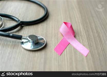 Breast Cancer Awareness, Pink Ribbon with Stethoscope for supporting people living and illness. Woman Healthcare and World cancer day concept