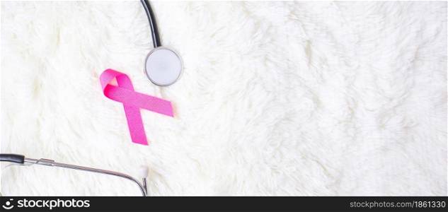 Breast Cancer Awareness, Pink Ribbon with Stethoscope on white background for supporting people living and illness. Woman Healthcare and World cancer day concept