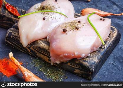 breast chicken meat. Raw chicken meat on the kitchen cutting board