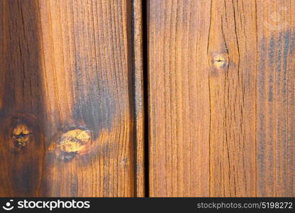 brebbia abstract rusty brass brown knocker in a door curch closed wood italy lombardy