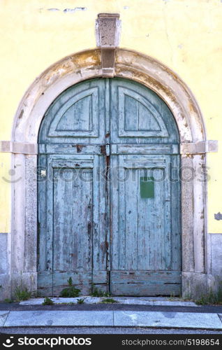 brebbia abstract rusty brass brown knocker in a door curch closed wood italy lombardy