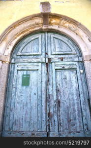 brebbia abstract rusty brass brown knocker in a door curch closed wood italy lombardy