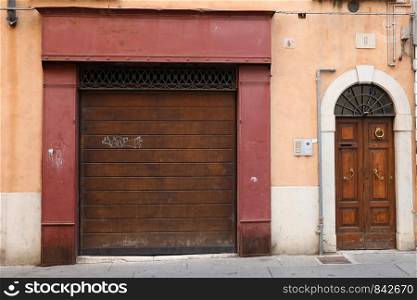 Brescia (Italy): view of an ancient shop with the characteristic wooden door