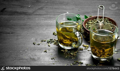 Brewed fragrant green tea. On the black chalkboard. Brewed fragrant green tea.