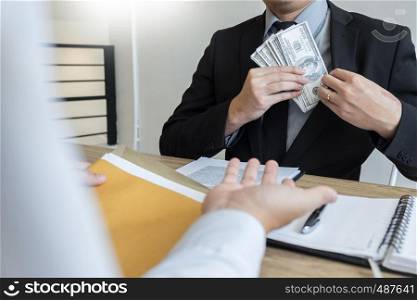 bribe and corruption concept, Corrupted businessman sealing the deal hand receiving venality bribe money from partner.