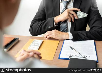 Bribery and corruption, Businessman hand giving money and receive in the envelope offered file Dishonest cheating in business illegal money concept