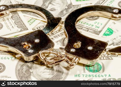 Bribes and handcuffs. Close-up shot