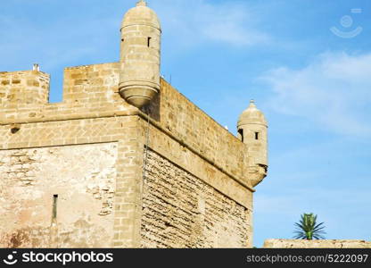 brick in old construction africa morocco and the tower near sky