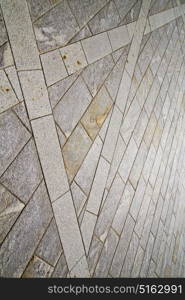 brick in the casorate sempione street lombardy italy varese abstract pavement of a curch and marble