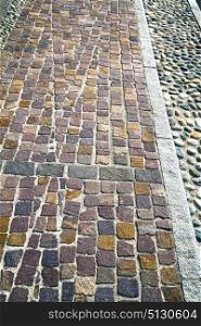 brick in varano borghi street lombardy italy varese abstract pavement of a curch and marble