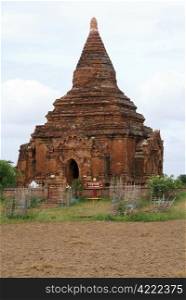 Brick pagoda and field in Baghan, Myanmar