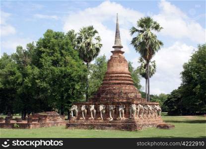 Brick pagoda with elephants in old Sukhotai, Thailand