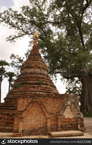 Brick stupa under tree in Inwa, Mandalay, Myanmar