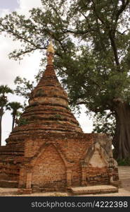 Brick stupa under tree in Inwa, Mandalay, Myanmar