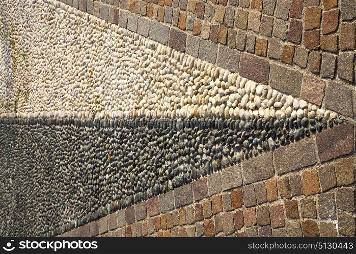 brick the in mozzate street lombardy italy varese abstract pavement of a curch and marble