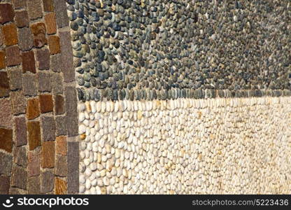 brick the in mozzate street lombardy italy varese abstract pavement of a curch and marble