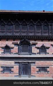 Brick wall amnd wooden windows of king&rsquo;s palace in Bhaktapur, Nepal