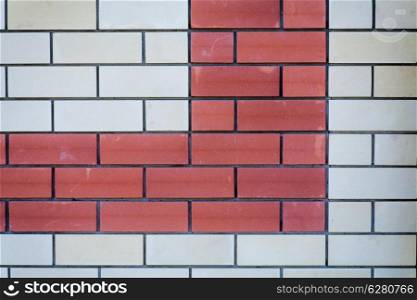Brick wall background. Red and white bricks, a lot of copyspace. Wall of a modern building as backdrop