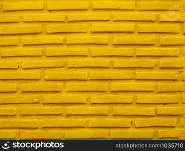 Brick wall background with yellow color.