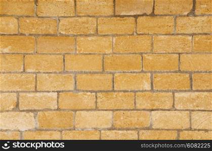 Brick wall made of light yellowish stones