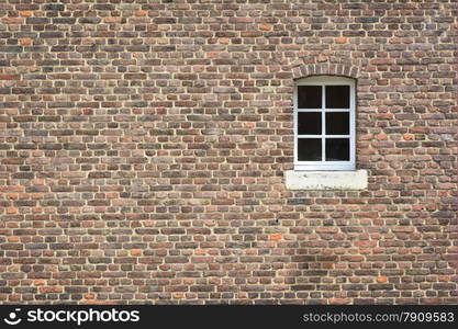 brick wall of old castle with window